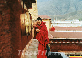 Mobile phone use among lamas, Jokhang Temple, Lhasa
